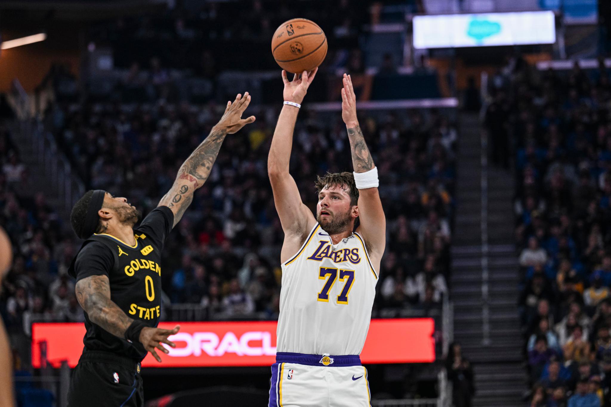 Los Angeles Lakers guard Luka Doncic (77) shoots over Golden State Warriors guard Gary Payton II (0) during an NBA Cup game, Friday, Oct. 30, 2026, in San Francisco.