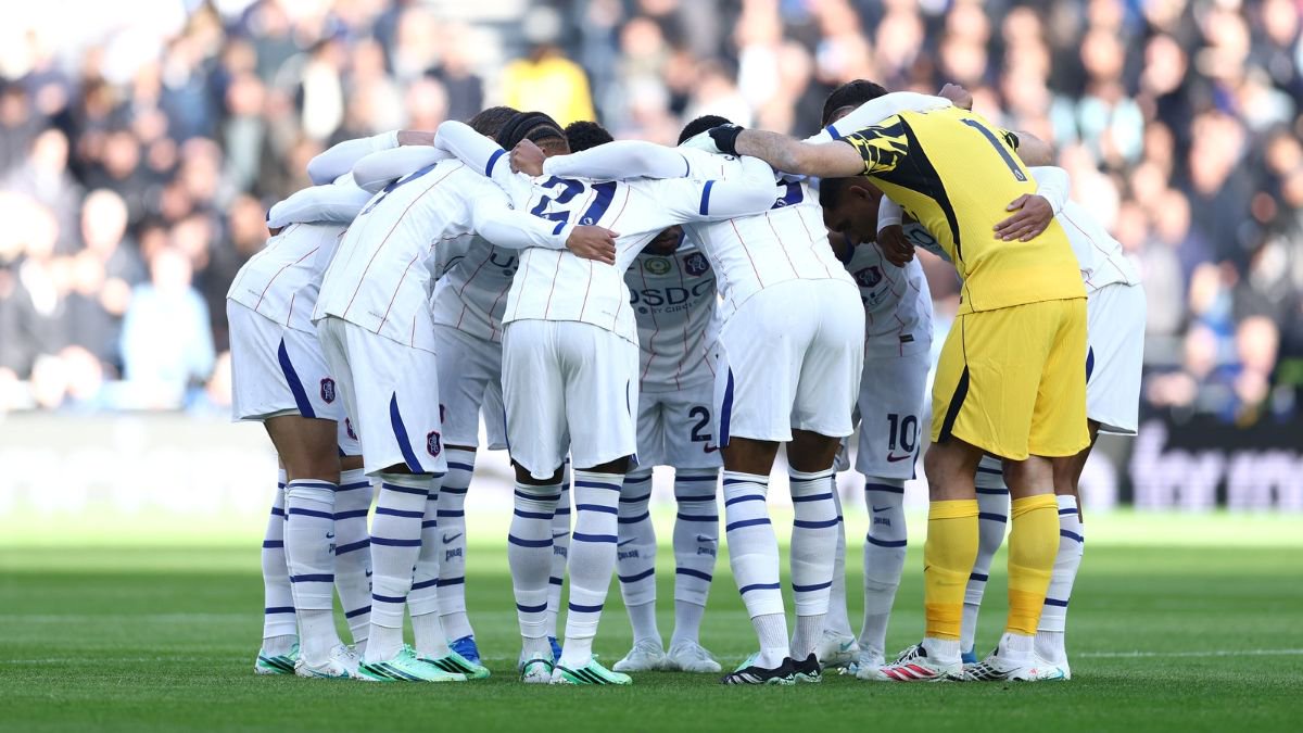 Chelsea players in a generic group huddle.