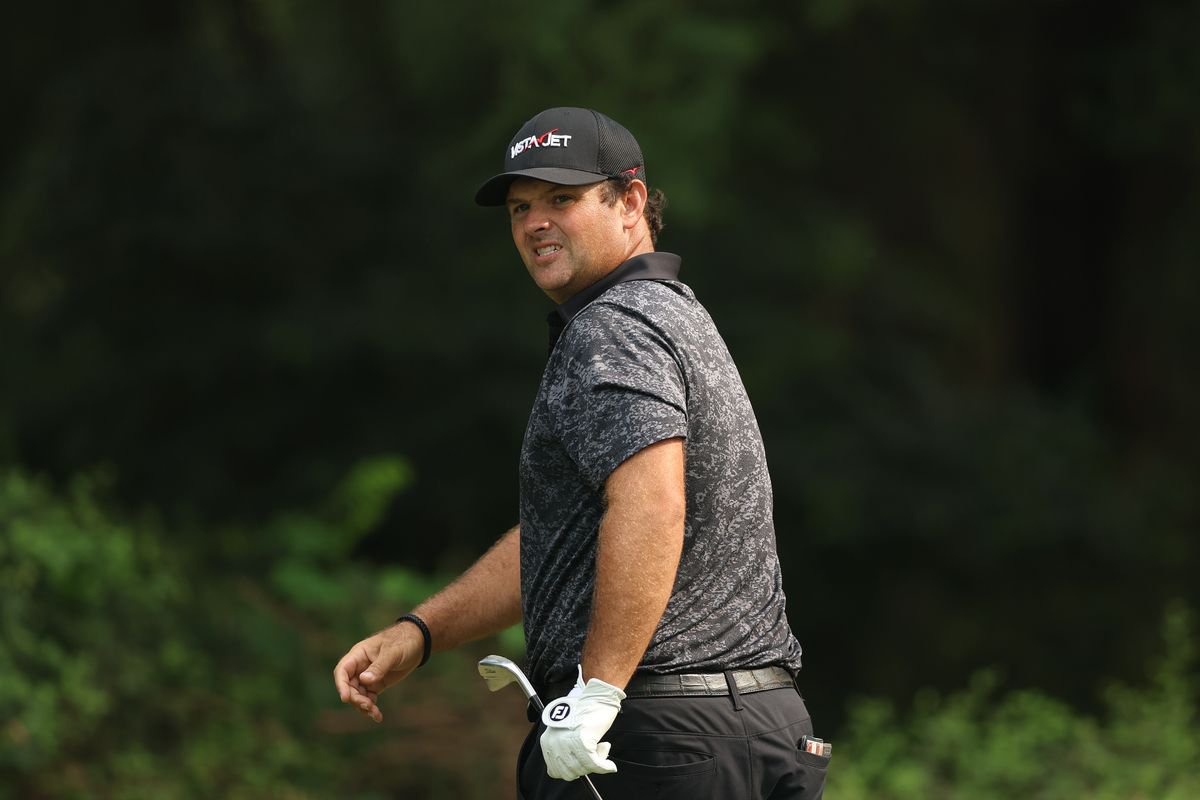 Patrick Reed looks on