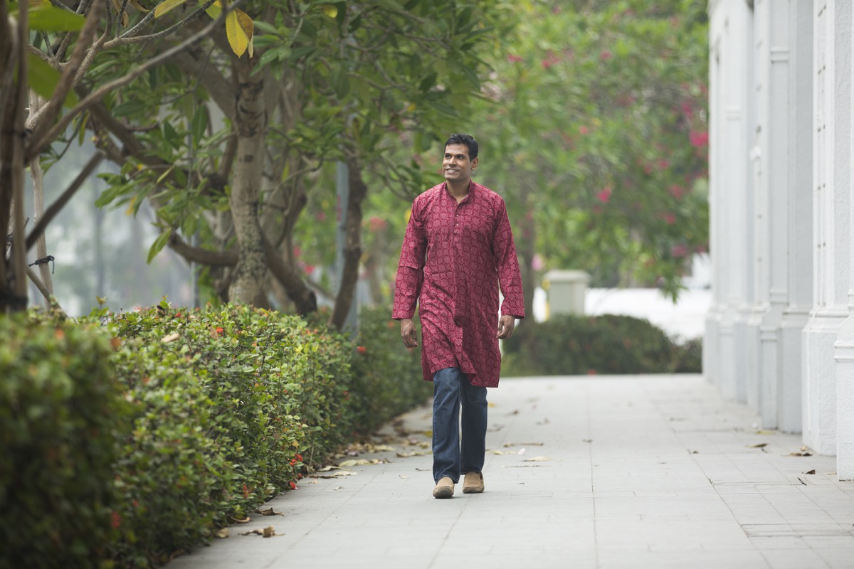 Indian man walking around outside