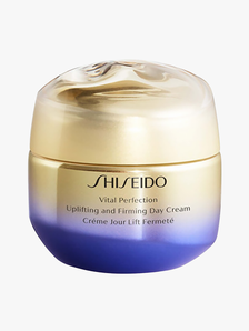 Shiseido Vital Perfection Uplifting and Firming Day Cream SPF 30 in abstract gold and purple gradient jar with lid on light gray background