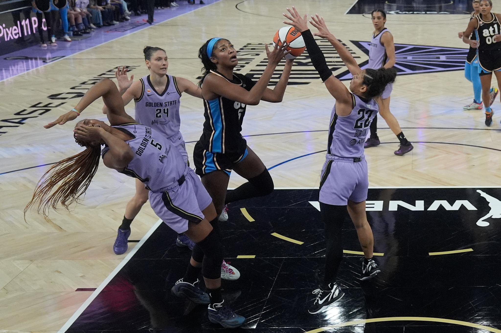 Angel Reese goes up for a shot as Kayla Thornton, Cecilia Zandalasini, and Veronica Burton defend.