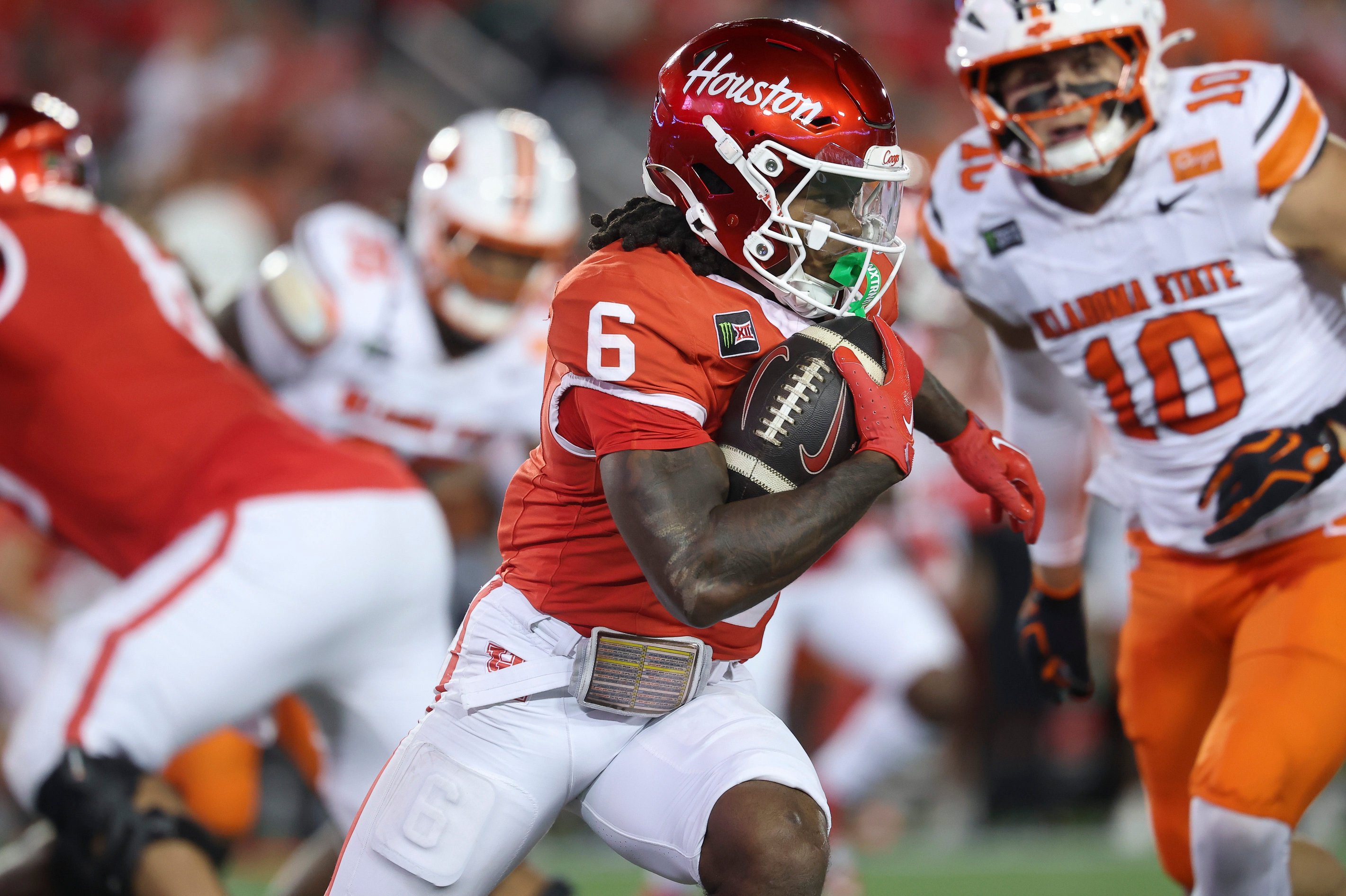 Oct 17, 2026; Houston, Texas, USA; Houston Cougars running back Re'shaun Sanford II (6) runs with the ball during the third quarter against the Oklahoma State Cowboys at TDECU Stadium. Mandatory Credit: Troy Taormina-Imagn Images