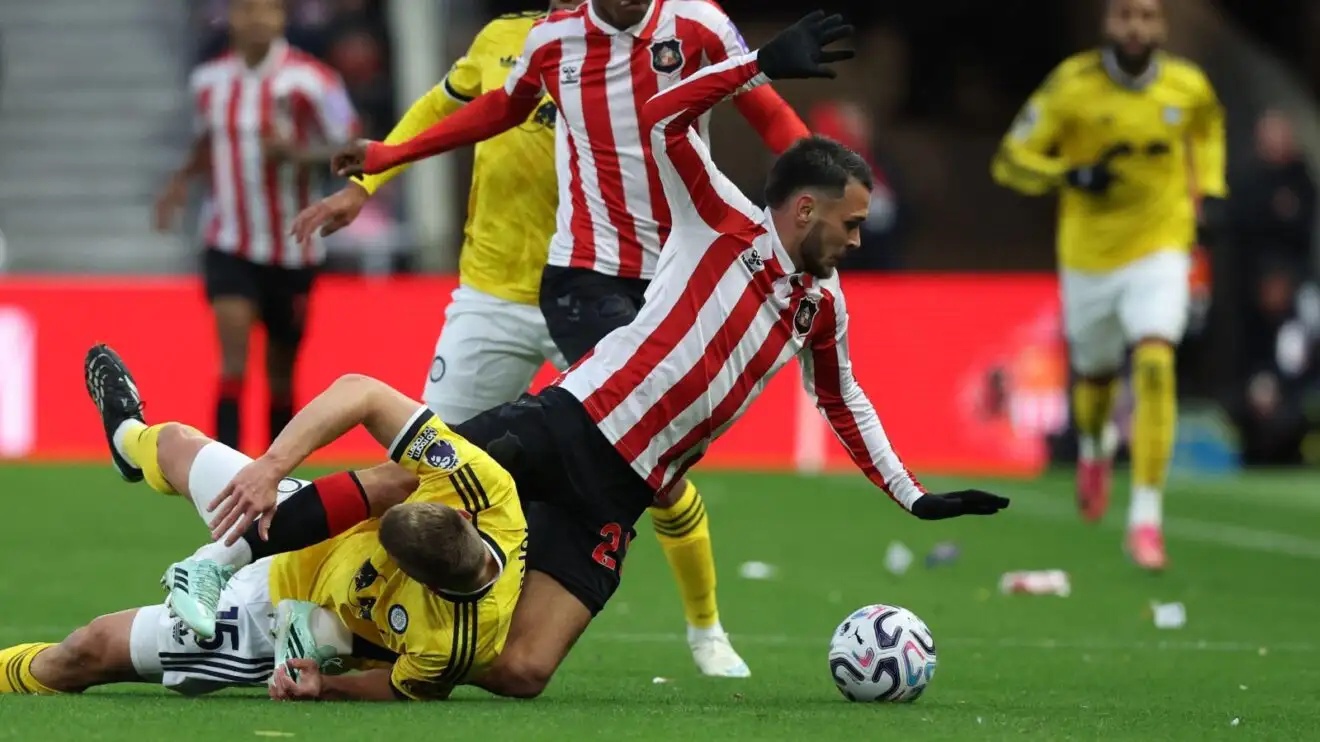 Leeds defender Jaka Bijol tackles Sunderland player Enzo Le Fee