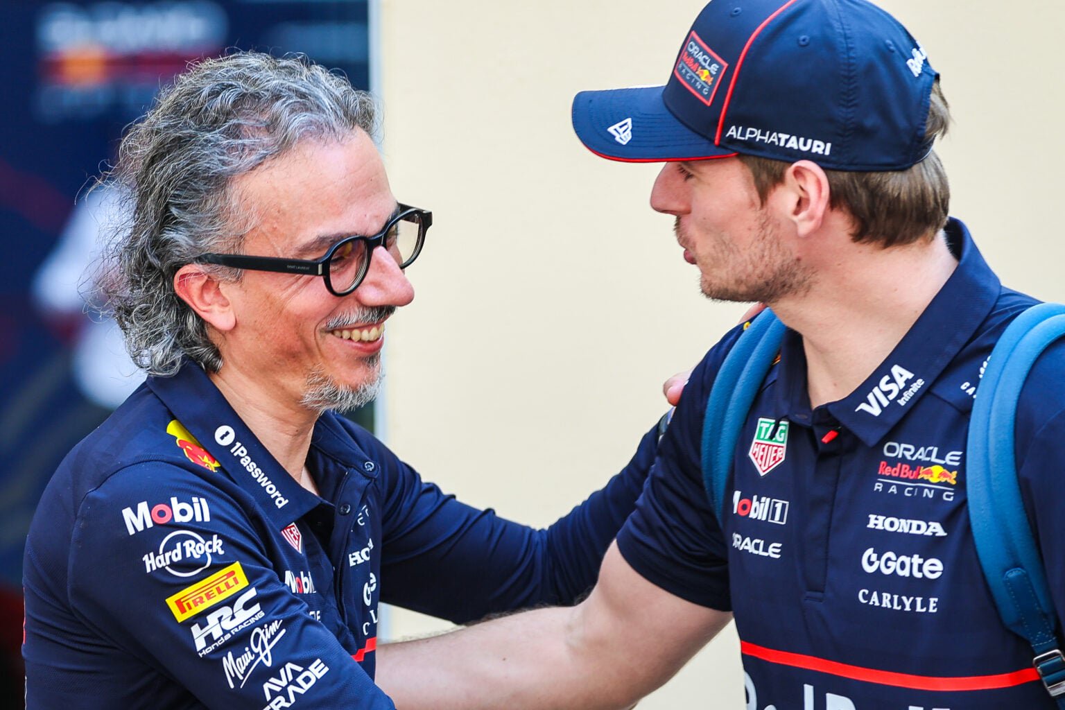 Max Verstappen (R) of the Netherlands and Oracle Red Bull Racing greets Oracle Red Bull Racing CEO and Team Principal Laurent Mekies in the paddock during previews ahead of the F1 Grand Prix of Abu Dhabi at Yas Marina Circuit on December 4, 2025 in Abu Dhabi, United Arab Emirates.