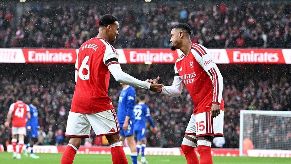 Ezri Konsa celebrates scoring Arsenal's goal with Gabriel Magalhaes