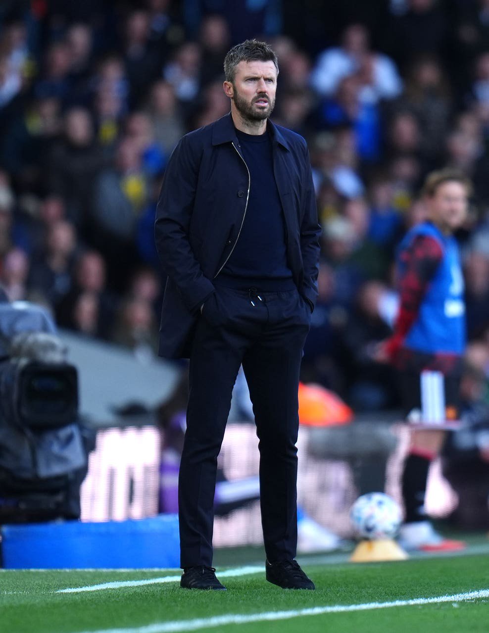 Michael Carrick watches on from the touchline 