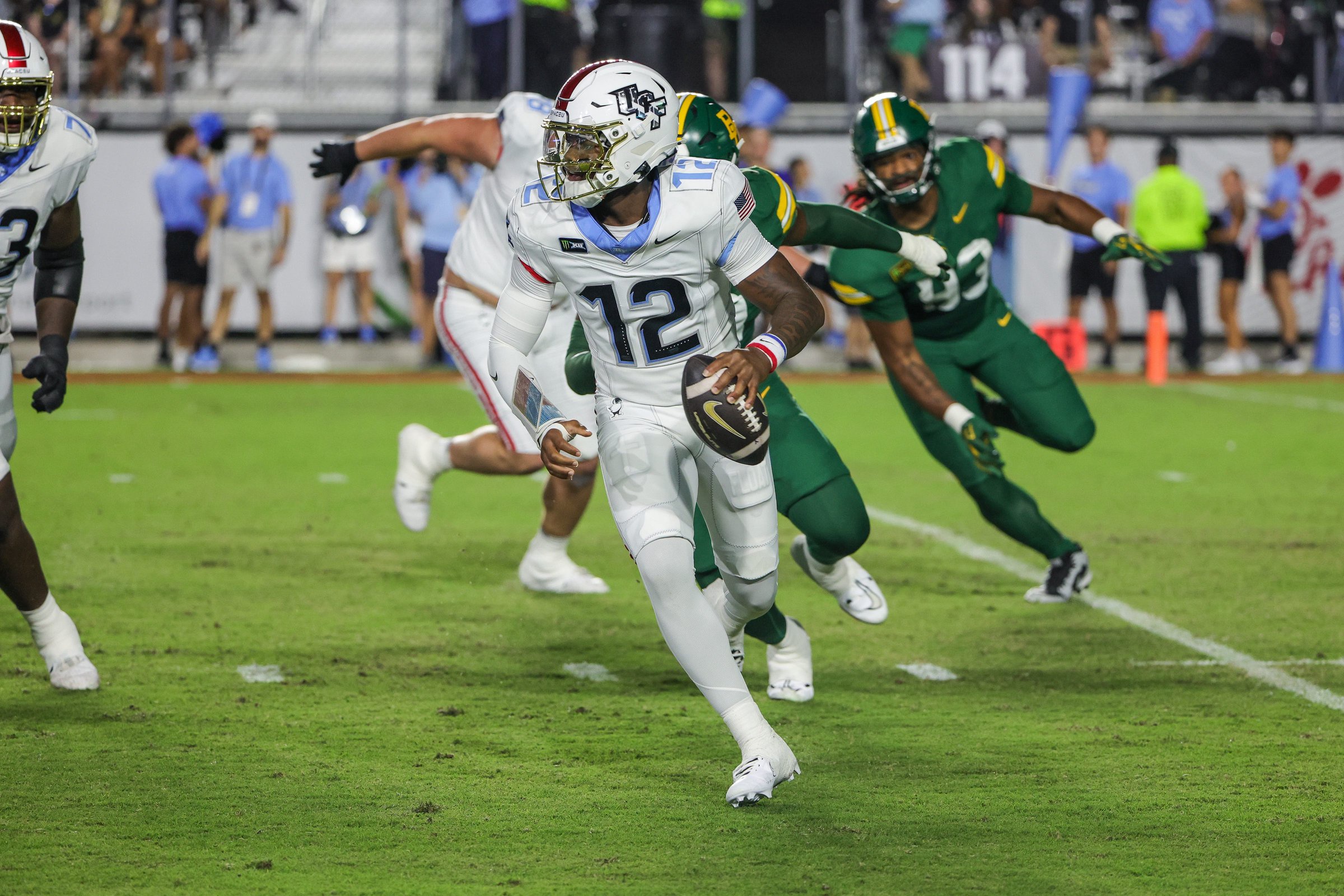 Oct 30, 2026; Orlando, Florida, USA;  Central Florida Knights quarterback Keyone Jenkins (12) looks to pass during the first quarter against the Baylor Bears at Acrisure Bounce House.  Mandatory Credit: Mike Watters-Imagn Images