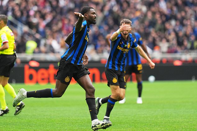 Inter Milan's Marcus Thuram celebrates scoring his side's opening goal during the Serie A soccer match between Inter Milan and Fiorentina, in Milan, Italy, Sunday, Oct. 25, 2026. (AP Photo/Antonio Calanni)