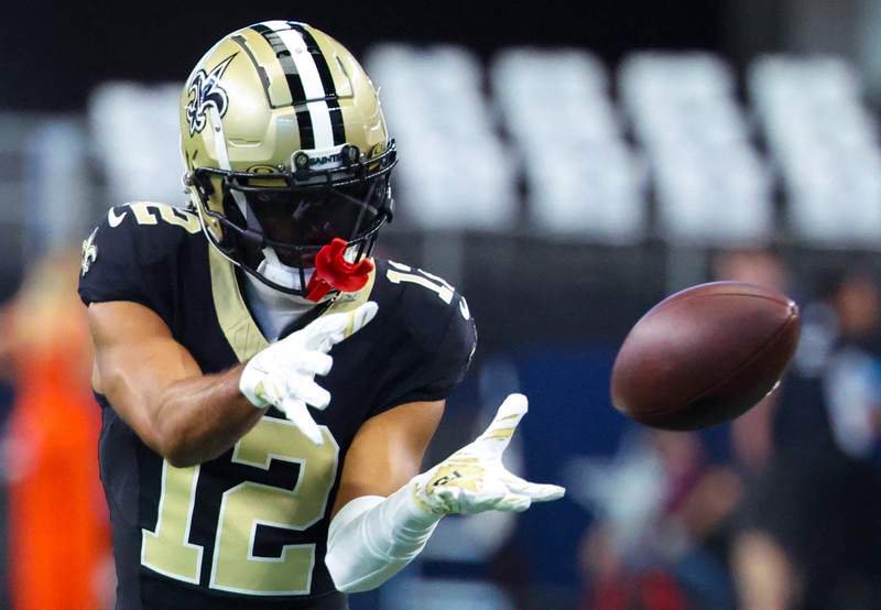 Sep 15, 2024; Arlington, Texas, USA; New Orleans Saints wide receiver Chris Olave (12) warms up before the game against the Dallas Cowboys at AT&T Stadium. Mandatory Credit: Kevin Jairaj-Imagn Images