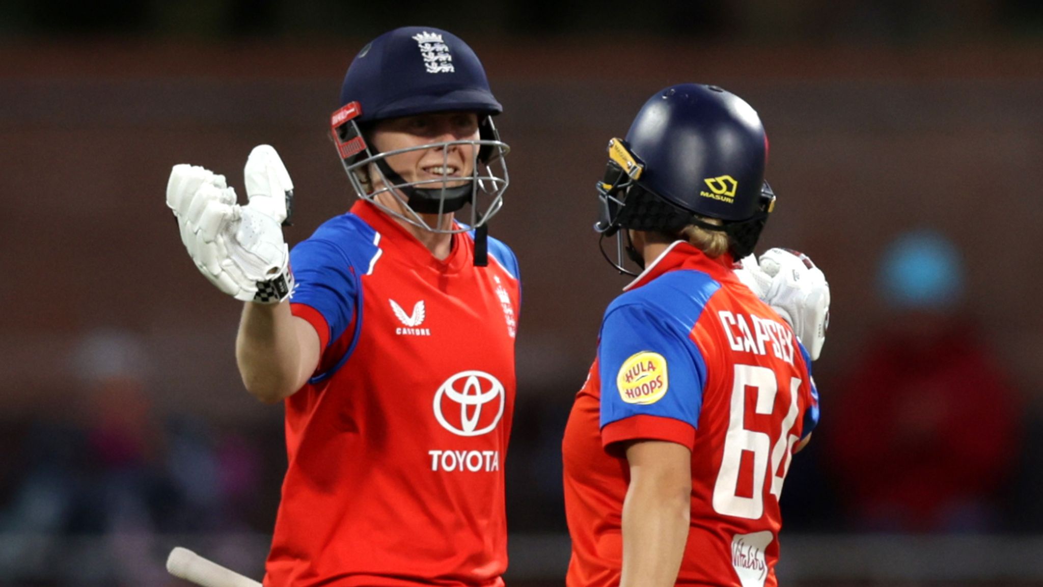 Heather Knight (left) celebrates bringing up her half-century alongside Alice Capsey (right) 
