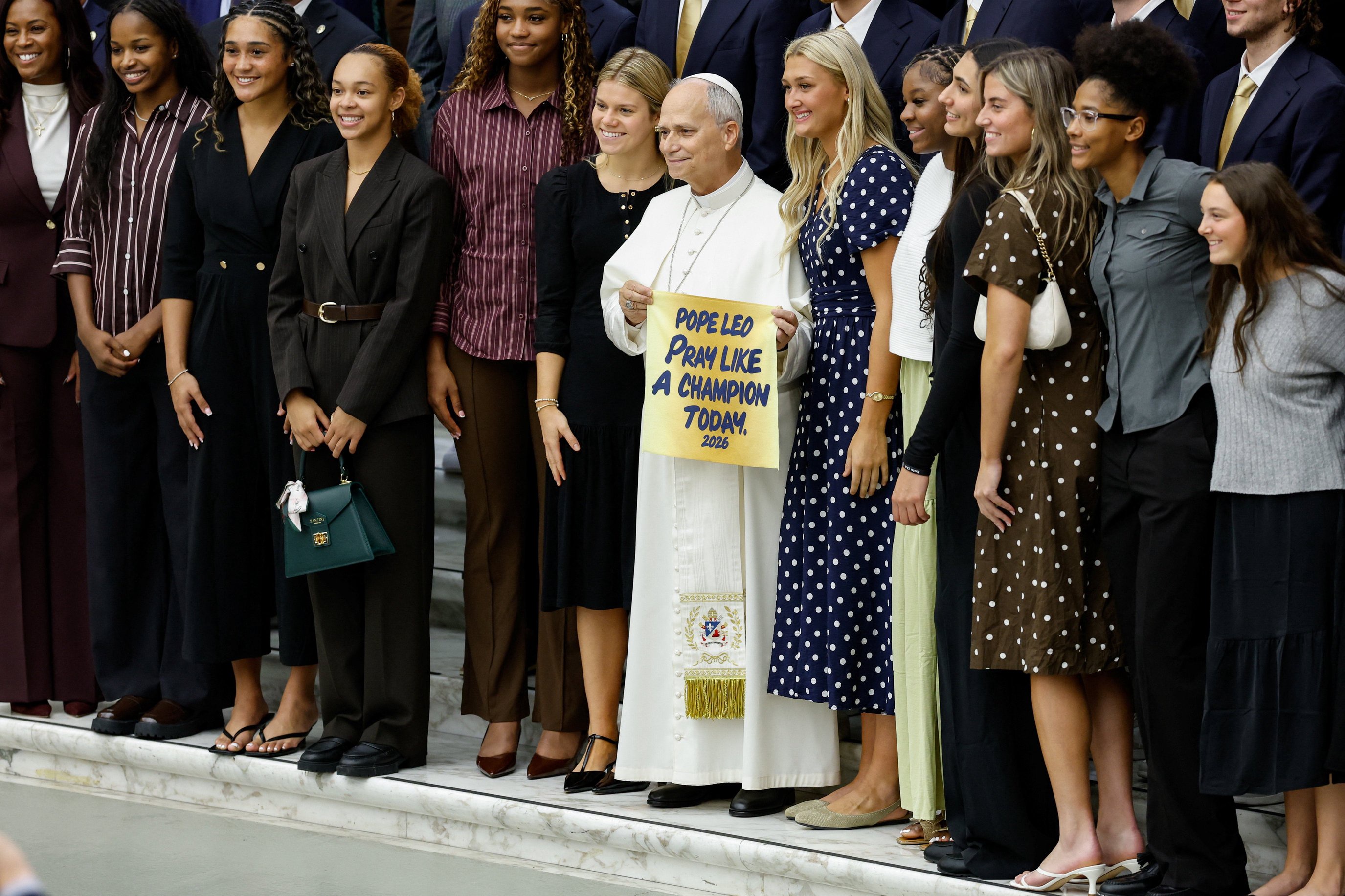 Pope Leo poses with a delegation from the Notre Dame Fighting Irish basketball team ahead of the opening of the US college basketball season, at the Paul VI Audience Hall at the Vatican, October 31, 2026