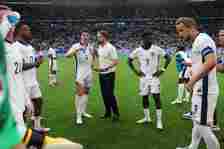 Gareth Southgate, Manager of England men's senior team, gives instructions to Declan Rice during half time of extra-time during the UEFA EURO 2024 ...