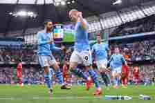 Erling Haaland of Manchester City celebrates with Bernardo Silva of Manchester City (L) after scoring their 1st goal during the Premier League matc...
