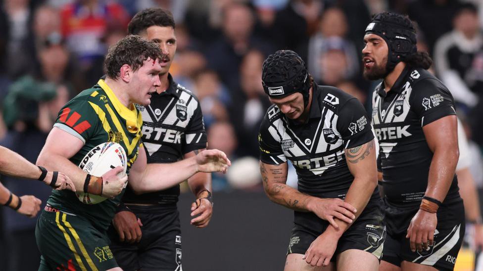 New Zealand's Kalyn Ponga feels his injured left arm during the World Cup game against Australia