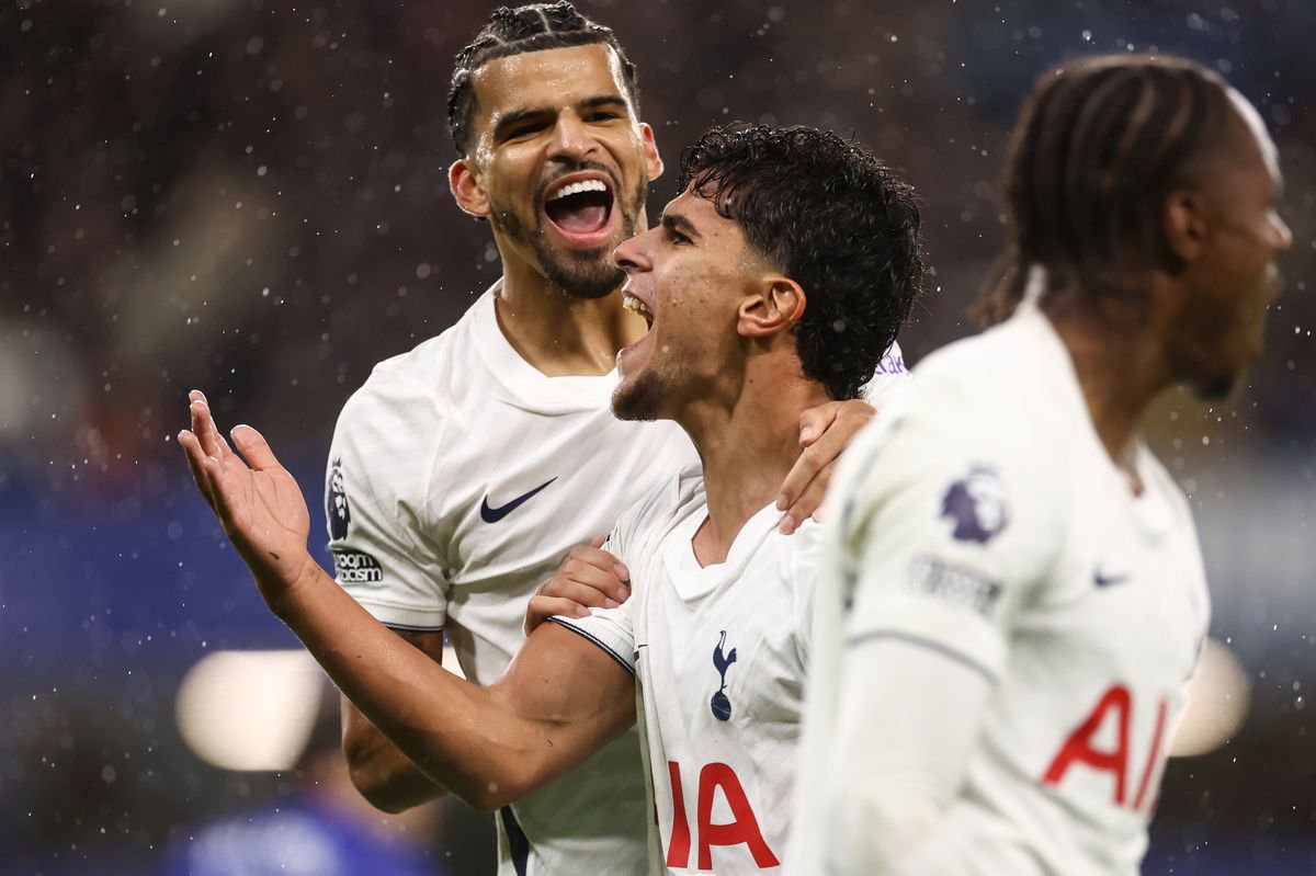 Mateus Fernandes celebrates the first goal with Dominic Solanke and Mathys Tel of Tottenham Hotspur during the Premier League match between Chelsea and Tottenham Hotspur at Stamford Bridge