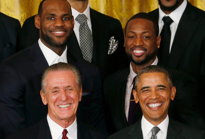Miami Heat player general manager Pat Riley stands beside U.S. President Barack Obama with stars Lebron James (L) and Dwayne Wade behind them as Obama honors the NBA basketball champions Miami Heat at the White House in Washington January 14, 2014.  

REUTERS/Kevin Lamarque  (UNITED STATES - Tags: POLITICS SPORT BASKETBALL)