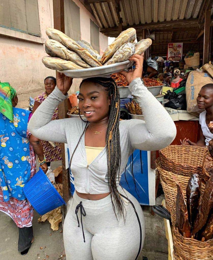 Is she selling fish or her body? See more photos of the fish monger who went viral on social media