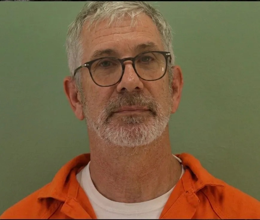 Mugshot of Terry Ward in an orange jumpsuit.