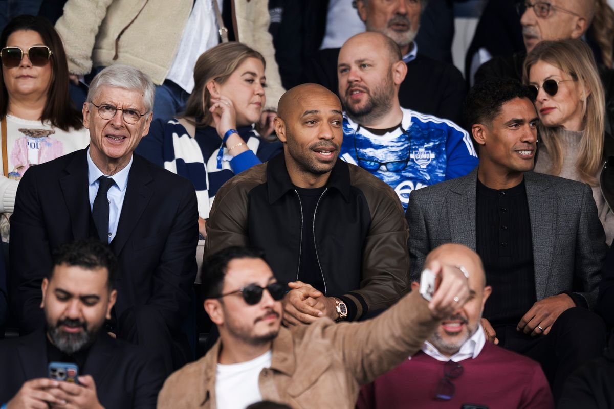Former Manchester United defender Raphael Varane pictured in the stands with Arsene Wenger and Thierry Henry at a Como match