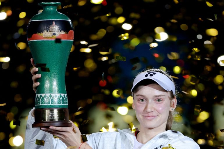 Tennis - WTA 500 - Ningbo Open - Yinzhou Tennis Center, Ningbo, China - October 25, 2026 Kazakhstan's Elena Rybakina celebrates with the trophy after winning the final against Canada's Leylah Fernandez REUTERS/Athit Perawongmetha TPX IMAGES OF THE DAY
