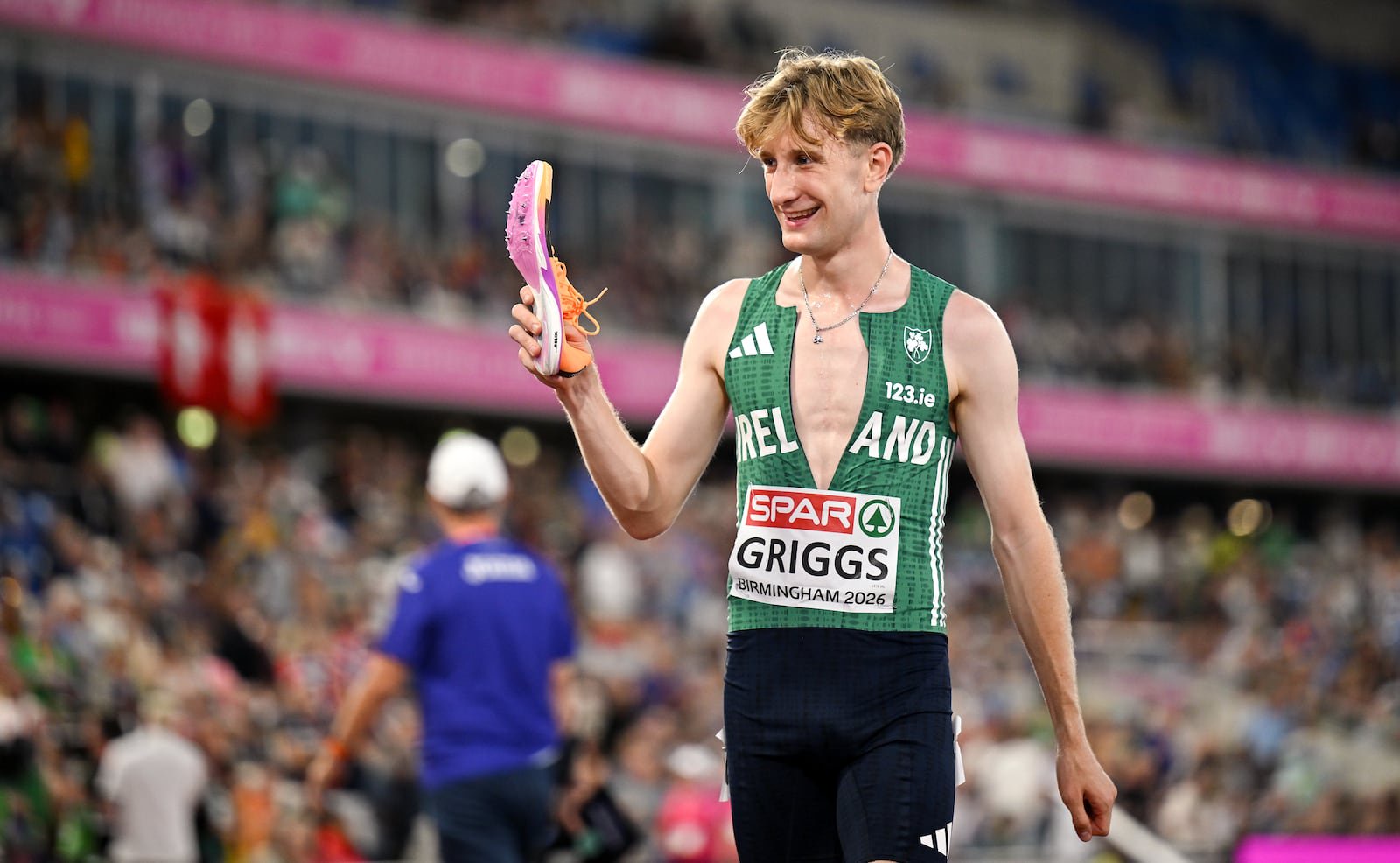 Nick Griggs of Ireland holds up a shoe after losing one during the men's 5000m final during day one of the European Athletics Championships 2026. Photo: Sam Barnes/Sportsfile via Getty