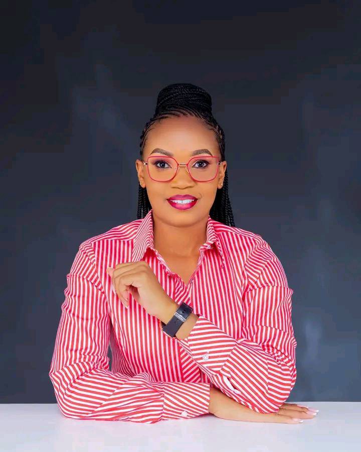 May be an image of 1 person, plaits, smiling and glasses