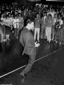 The then Prince danced with gusto as he was cheered on from the sidelines