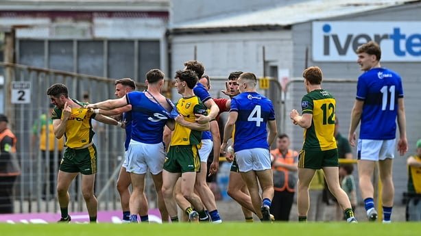Ryan McHugh of Donegal, left, points towards an injury in All-Ireland Championship game against Kerry - May 2026