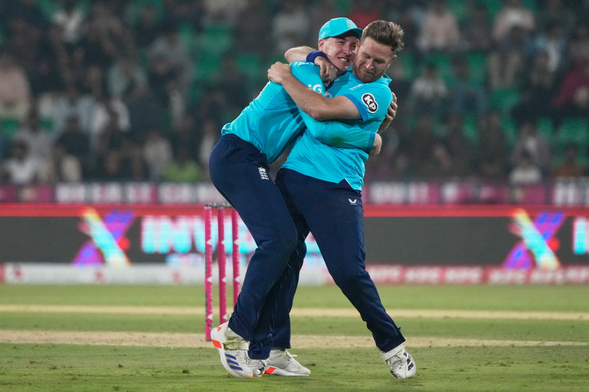 Liam Dawson, right, and Harry Brook celebrate the wicket of Salman Ali Agha.