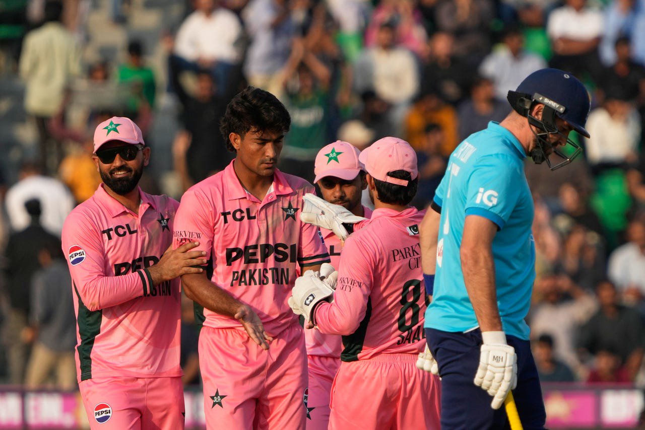 Raza Ullah, second from left, celebrates with team-mates after dismissing Liam Dawson