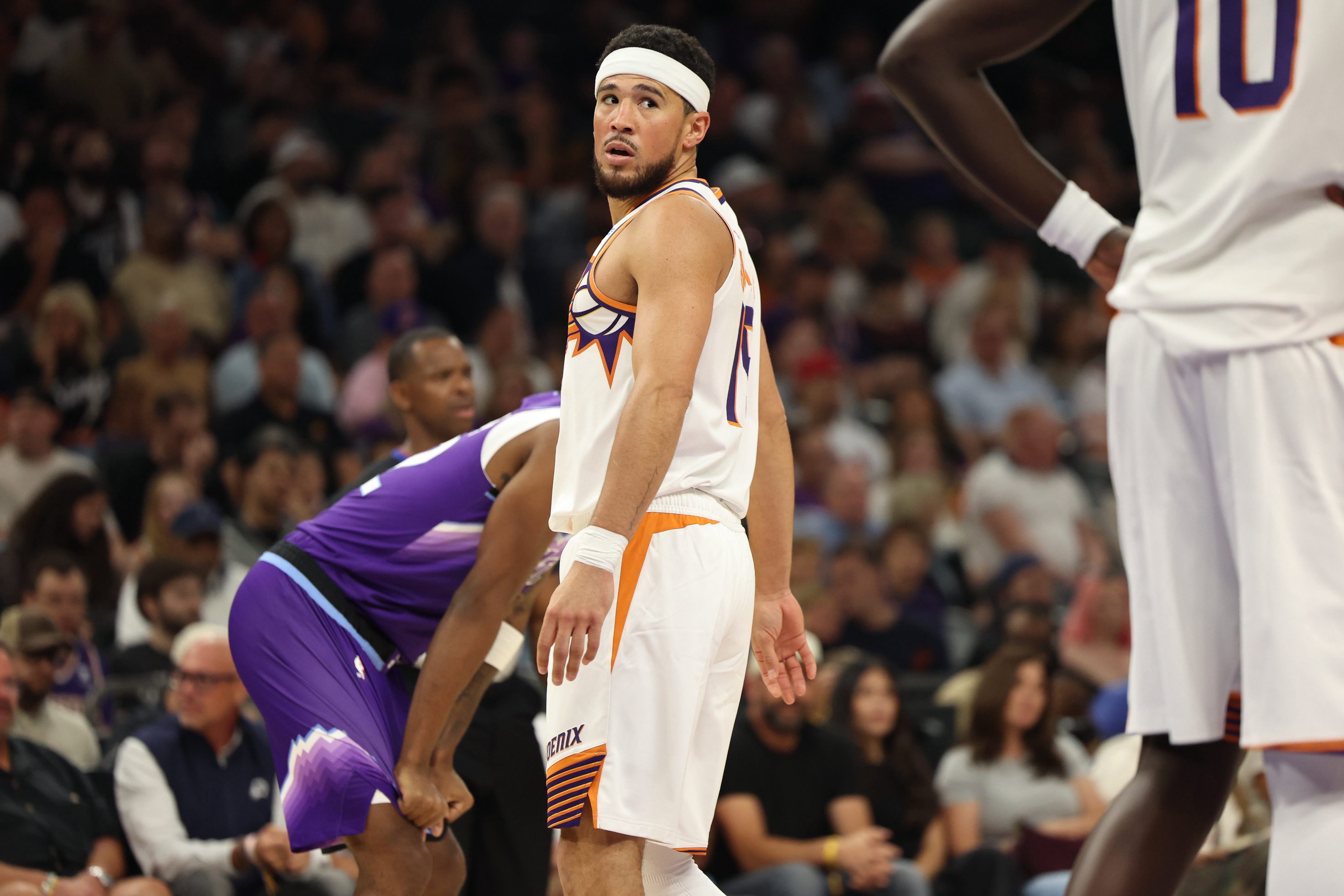 Oct 16, 2026; Phoenix, Arizona, USA;  Phoenix Suns guard Devin Booker (15) looks down court against the Utah Jazz in the first half at Mortgage Matchup Center.  Mandatory Credit: Anna Carrington-Imagn Images