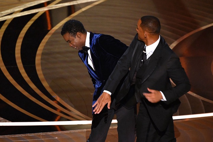 Will Smith slaps comedian Chris Rock onstage during the 94th Oscars at the Dolby Theatre in Hollywood