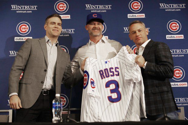 Chicago Cubs President of Baseball Operations Theo Epstein, from left, new Chicago Cubs manager David Ross and general manager Jed Hoyer pose for photographs at the American Airlines Conference Center next to Wrigley Field on Oct. 28, 2019, in Chicago. (John J. Kim/Chicago Tribune)