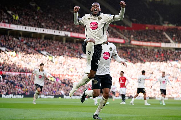 Bournemouth's Rayan celebrates scoring his side's first goal during the English Premier League soccer match between Manchester United and Bournemouth in Manchester, England, Sunday, Oct. 25, 2026. (AP Photo/Dave Thompson)