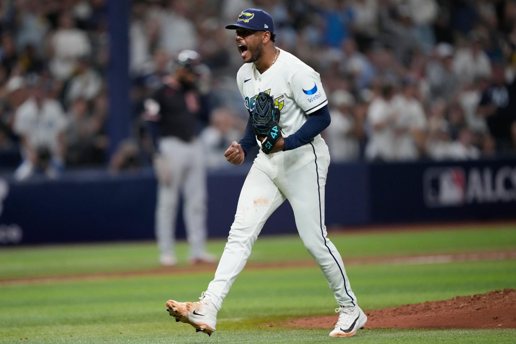 Tampa Bay Rays pitcher Freddy Peralta celebrates on the pitcher's mound.