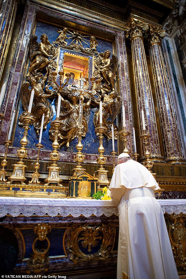 Pope Francis praying in Rome's Santa Maria Maggiore basilica, on March 15, 2020