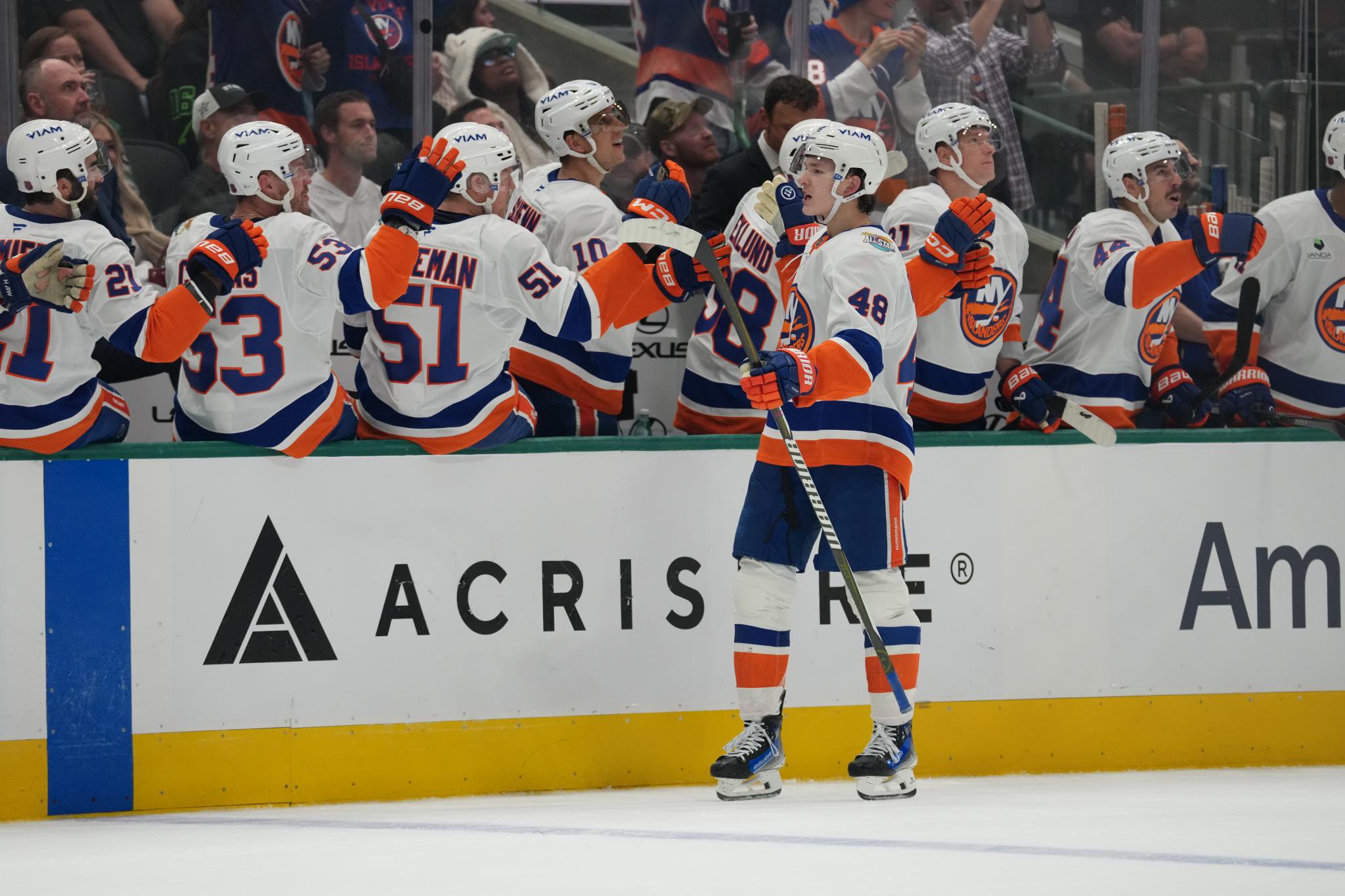 Matthew Schaefer of the New York Islanders celebrates a goal with teammates against the Dallas Stars.