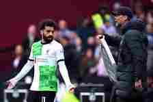 Mohamed Salah of Liverpool clashes with Jurgen Klopp, Manager of Liverpool, during the Premier League match between West Ham United and Liverpool F...
