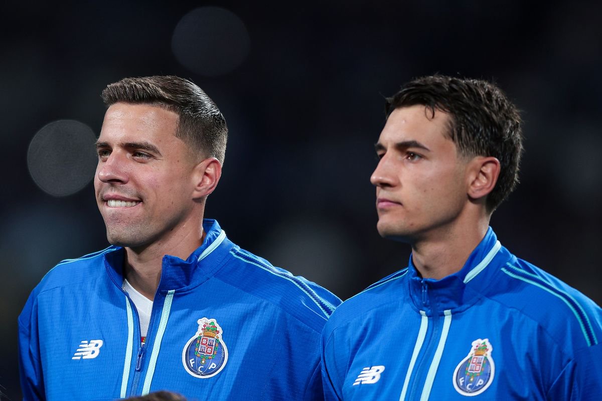 Jan Bednarek of FC Porto and Jakub Kiwior of FC Porto during the anthem prior to the UEFA Champions League 2026/27 League Phase MD3 match between FC Porto and PSV Eindhoven at Estadio do Dragao on October 20, 2026 in Porto, Portugal