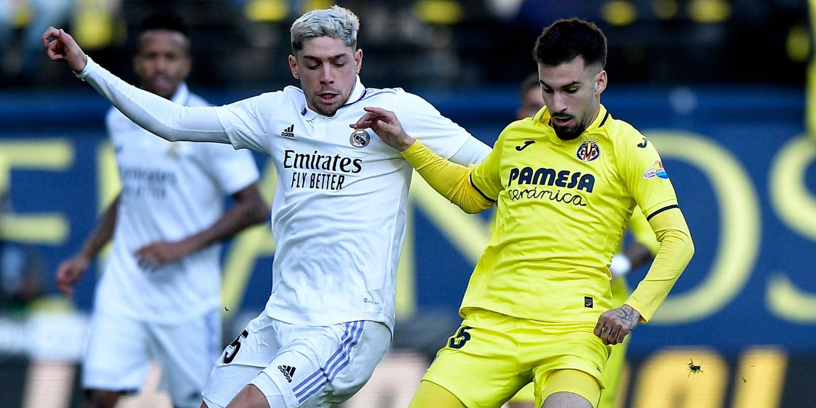 Real Madrid midfielder Federico Valverde and Villarreal's Alex Baena battling for possession