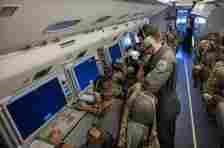 U.S. Airmen and Royal Australian Air Force airmen sit at the on-board mission consoles inside an E-7A Wedgetail aircraft prior to a Weapons School Integration mission at Nellis Air Force Base, Nevada, June 7, 2024. The on-board mission consoles help to provide battle management support to the U.S. Air Force Weapons School Integration participants. (U.S. Air Force photo by Airman 1st Class Brianna Vetro)