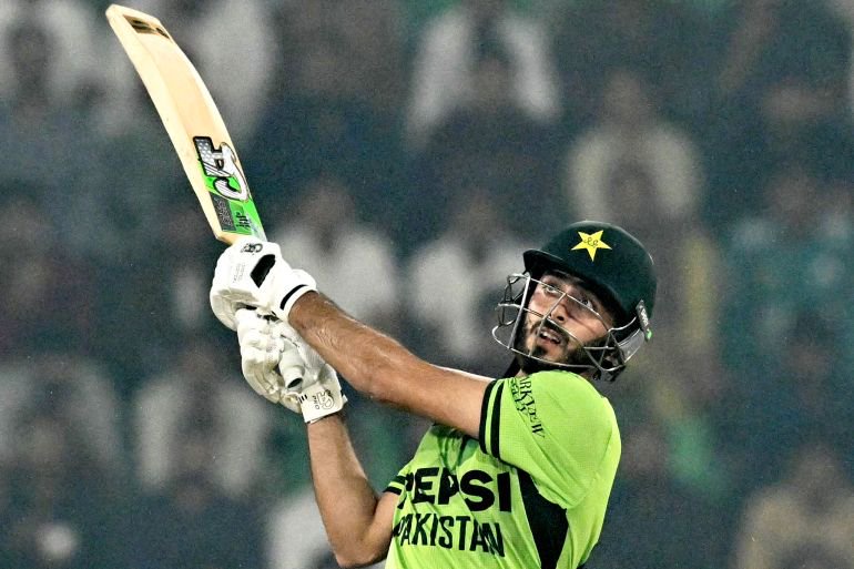Pakistan's Arafat Minhas watches the ball after playing a shot during the one-day international (ODI) tri-series final cricket match between Pakistan and Sri Lanka at the Gaddafi Stadium in Lahore on October 31, 2026. (Photo by ARIF ALI / AFP)