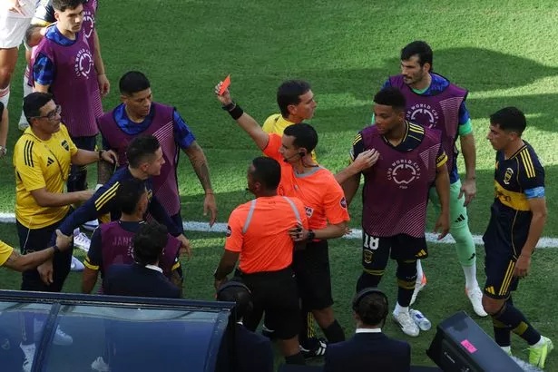 Ander Herrera of Boca Juniors is issued a red card