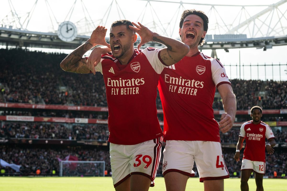 Bruno Guimaraes celebrates with Declan Rice