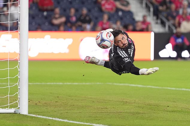 St. Louis City goalkeeper Roman Bürki deflects a shot during the first half of an MLS soccer match against the Vancouver Whitecaps Wednesday, Oct. 14, 2026, in St. Louis. (AP Photo/Jeff Roberson)