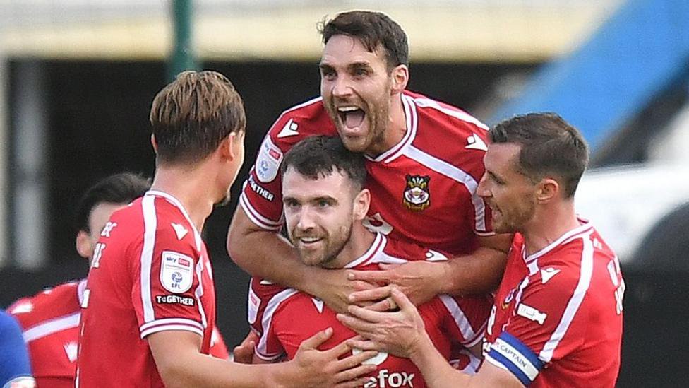 Wrexham players congratulate Ben Whiteman after his goal
