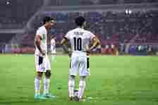 Egypt's forward Mohamed Salah (R) and Egypt's forward Omar Marmoush prepare to hit a free kick   during the Africa Cup of Nations (CAN) 2021 semi-f...