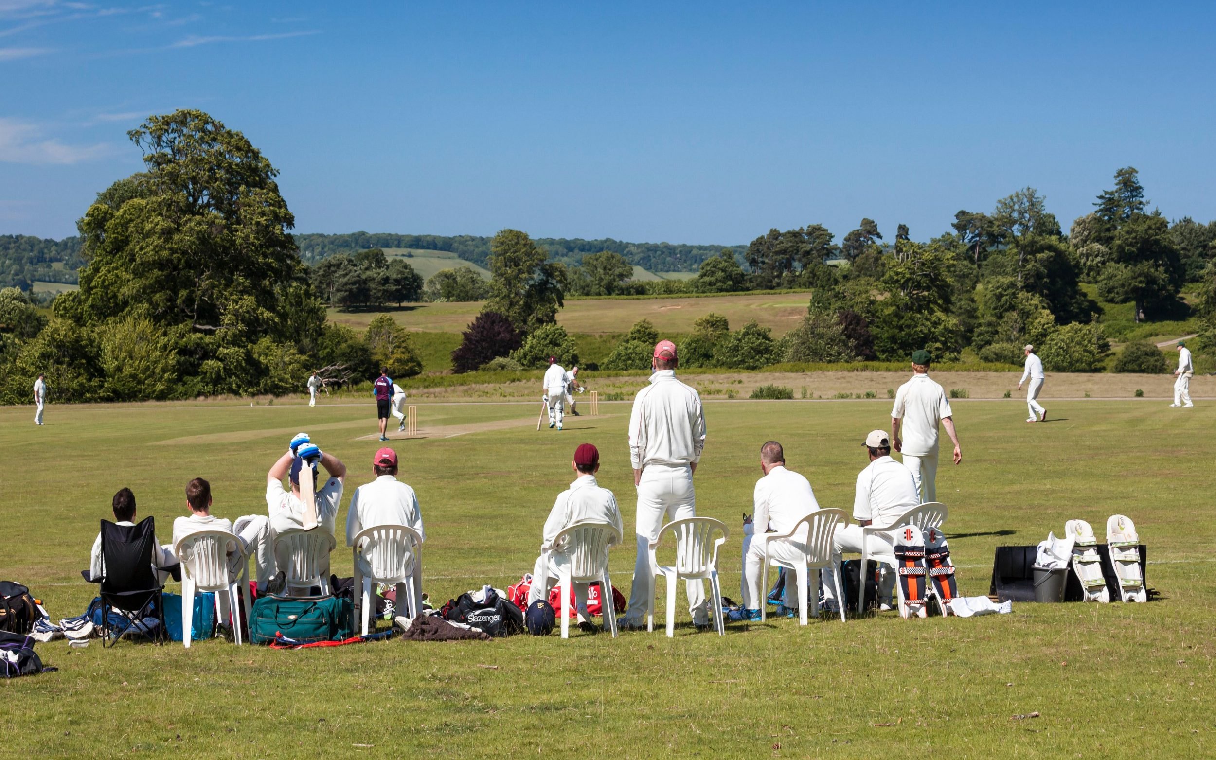 Men playing cricket in Knole Park Sevenoaks