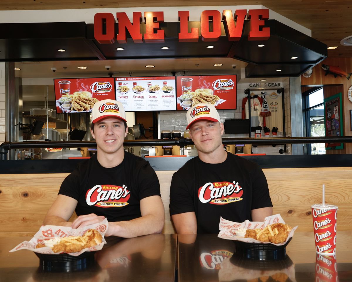 Luke McCaffrey and Christian McCaffrey at Raising Cane’s during Super Bowl Week 2026.Credit: Thos Robinson/Getty Images for Raising Cane's